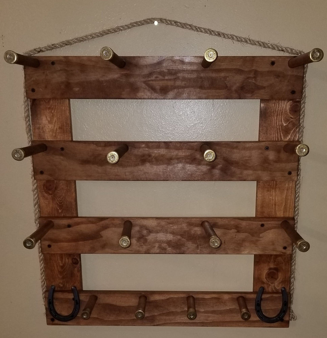 Walnut-toned wooden wall organizer with three empty shelves, metal pegs, two U hooks, and rope
