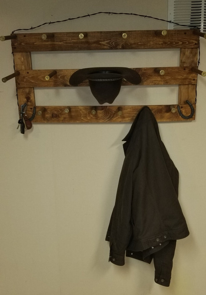 Wall-hanging western hat organizer with black hat slot and two shelves on wooden frame
