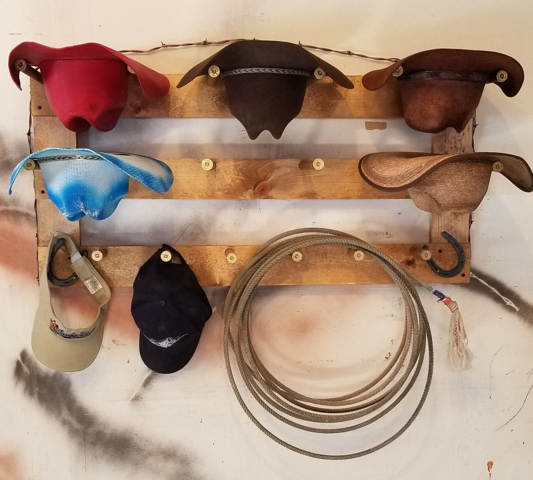 Horizontal wall-hanging hat organizer with colorful hats and coiled rope on wooden bars