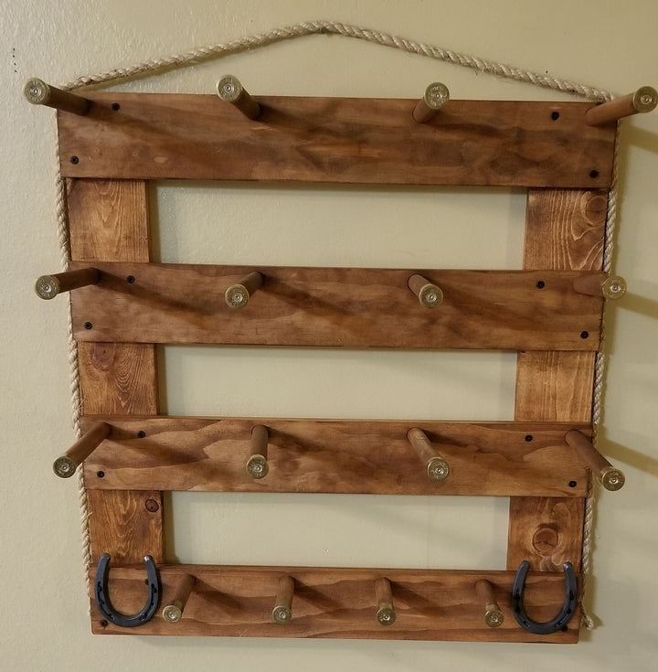 Light wood wall hanging organizer with three empty shelf panels, metal peg knobs, and U hooks
