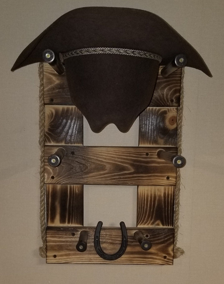 Brown vertical wall-hanging organizer with two hat slots and U-shaped hooks