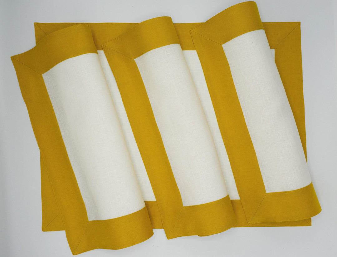 Set of 4 linen placemats, mustard borders with folded white centers