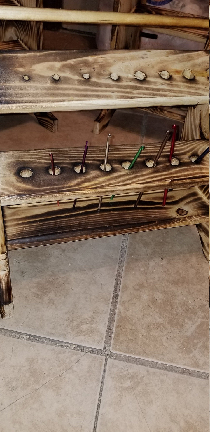 Wooden yarn holder with peg bars and multicolored yarn pins