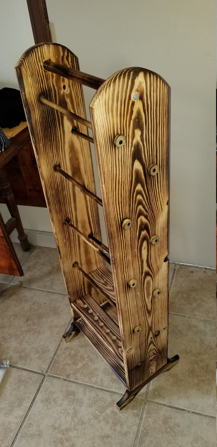 Wooden yarn holder organizer with decorative side panels and peg rows at base