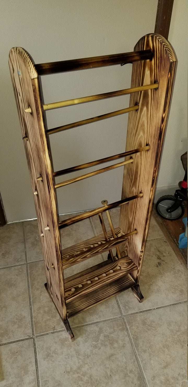 Wooden yarn organizer with side handles, tiered shelves, and front peg bars
