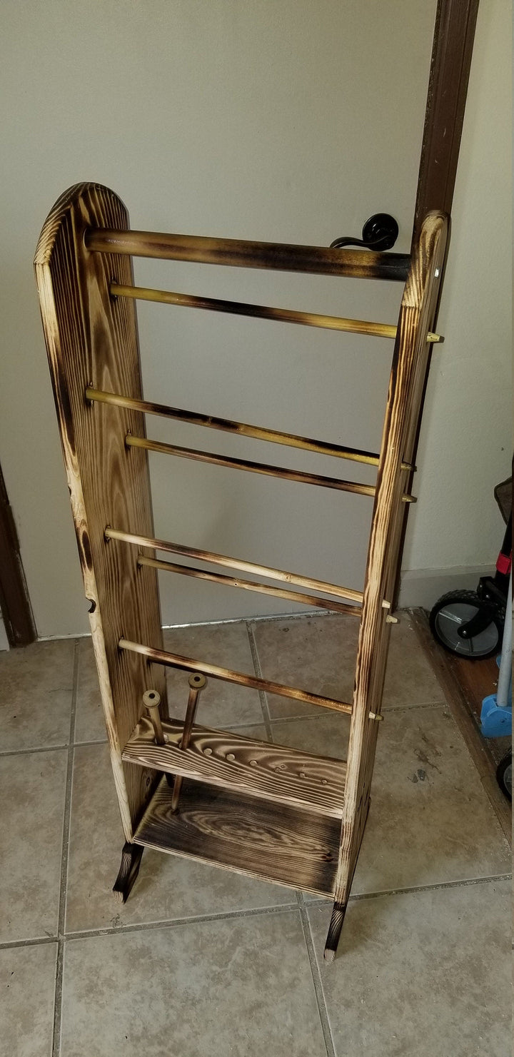 Wooden yarn holder with front pegs on a tall, slatted rack frame