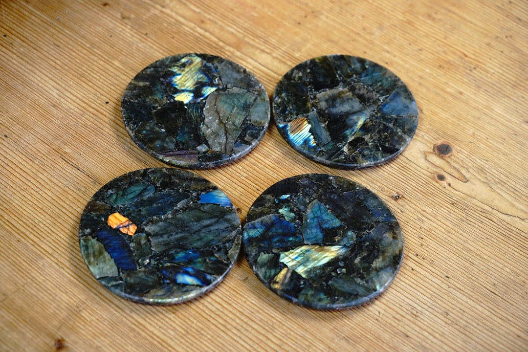 Round labradorite coasters, dark stone with blue flashes, top view set