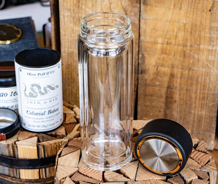 Tea infuser glass tumbler with removable lid and gold-accented cap