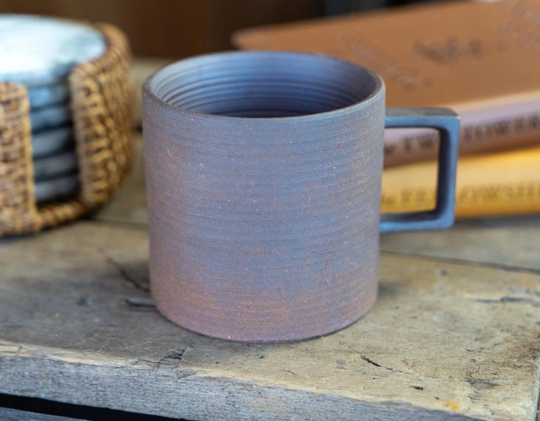 Stoneware espresso mug, light purple-gray matte glaze, textured cylinder with side handle