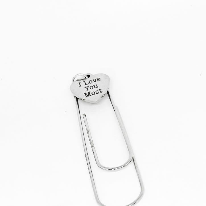 Stainless steel heart bookmark with engraved message on a paperclip style clip