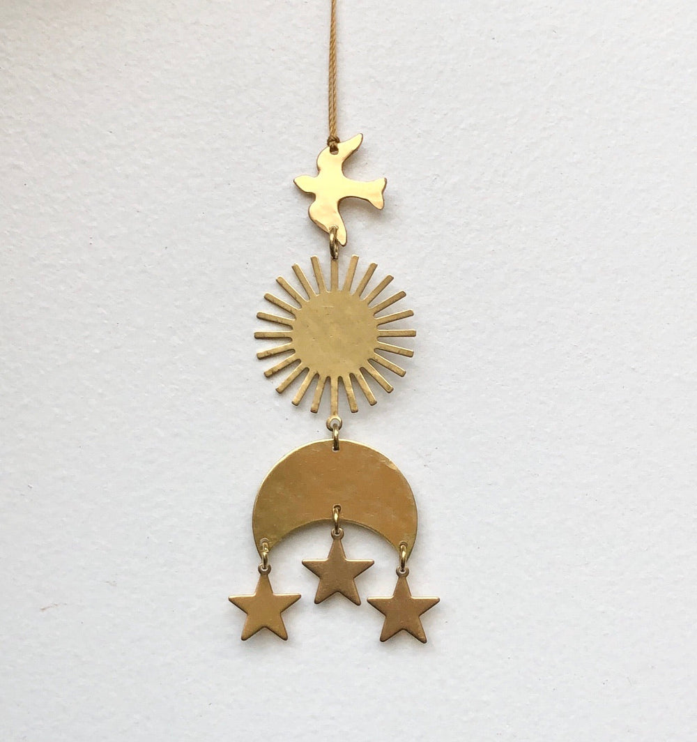 Gold hanging ornament on twine with star topper, sunburst, crescent, and three stars