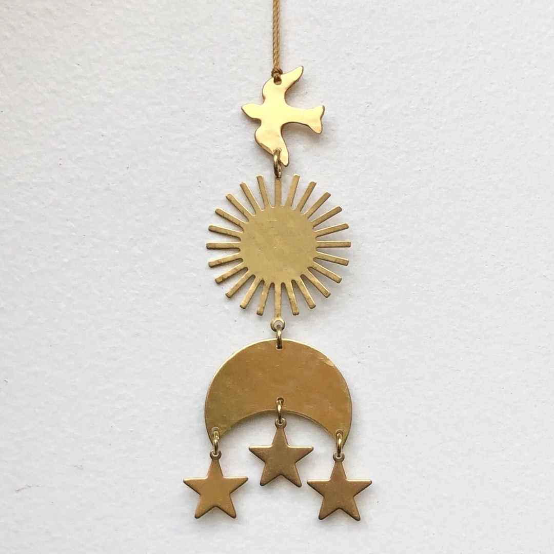 Gold hanging ornament with star topper, sunburst disc, crescent, and three dangling stars