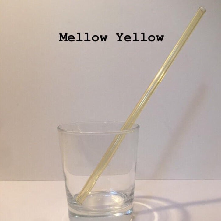 10-inch reusable straw in Mellow Yellow, shown diagonally in a clear drinking glass.