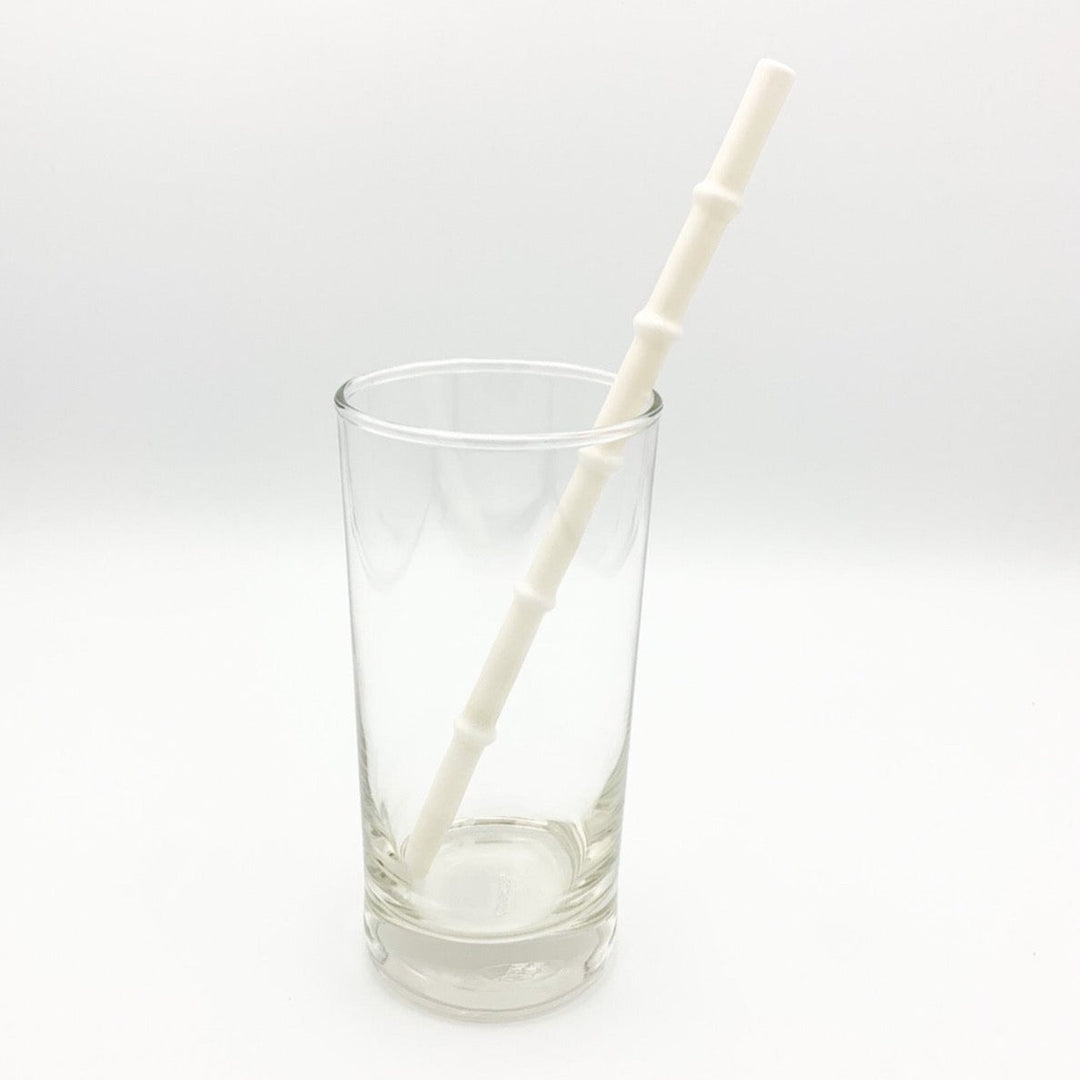 Bamboo-style drinking straw with light cream tip and ribbed segments