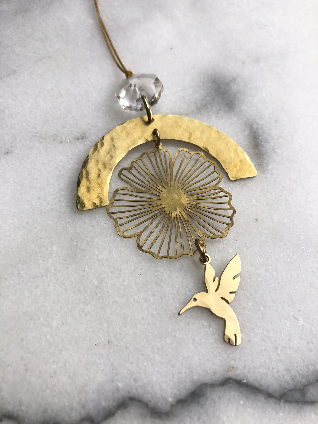 Gold hummingbird prayer ornament with filigree flower design, clear faceted glass crystal, cord loop