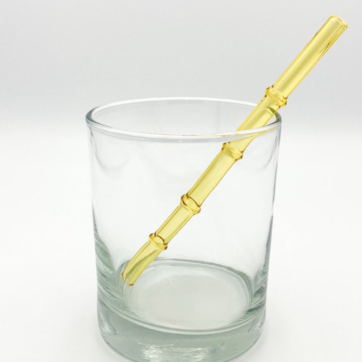 Bamboo-style drinking straw in golden yellow, ribbed segmented design
