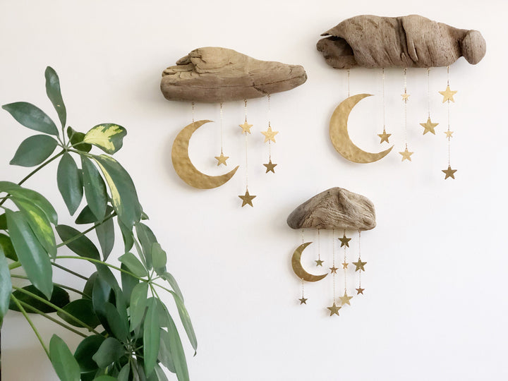 Set of three natural wood moon and star wall sculptures with dangling gold charms