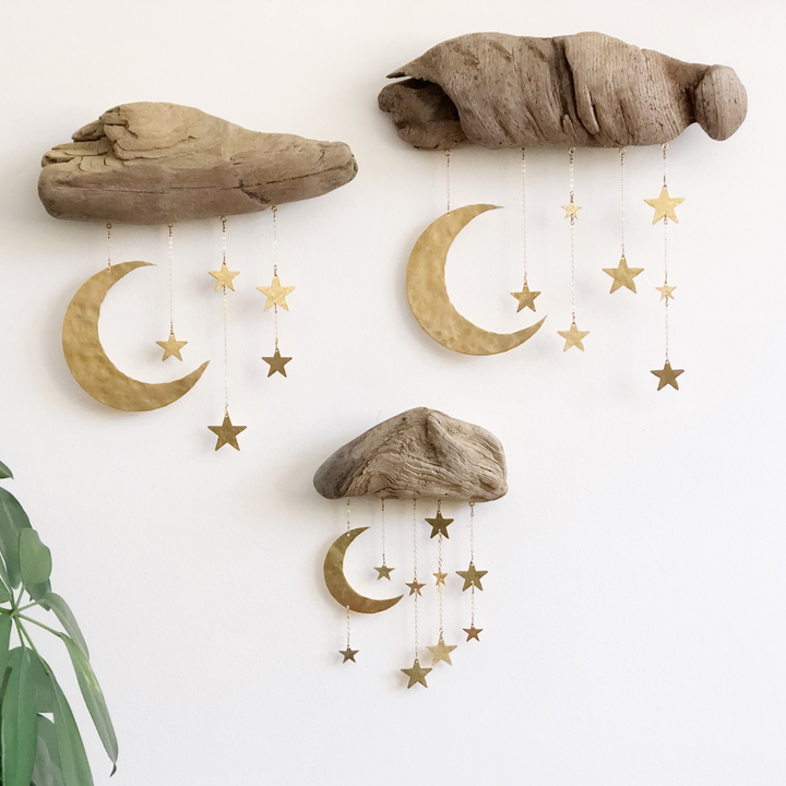 Natural wood moon and star wall sculpture with hanging gold star charms
