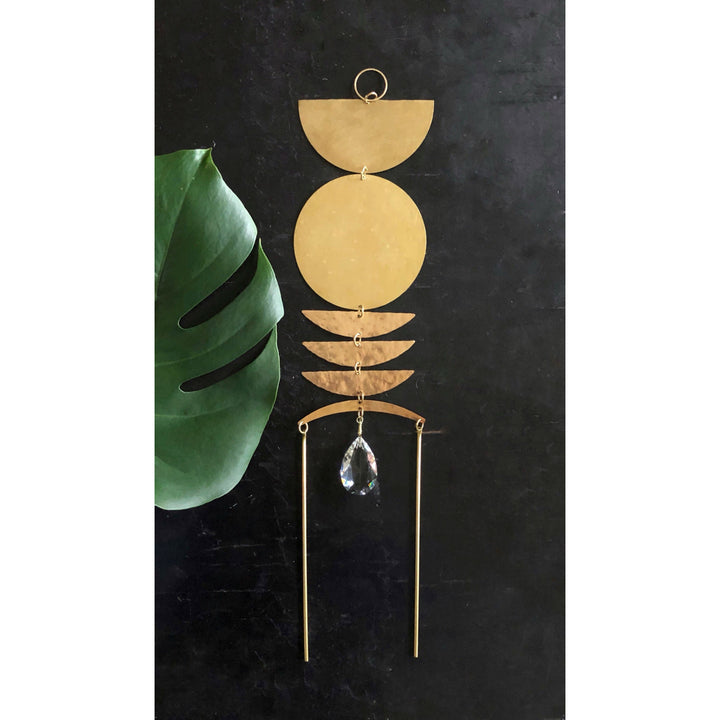Gold sun catcher with stacked discs, crystal teardrop pendant, two hanging rods
