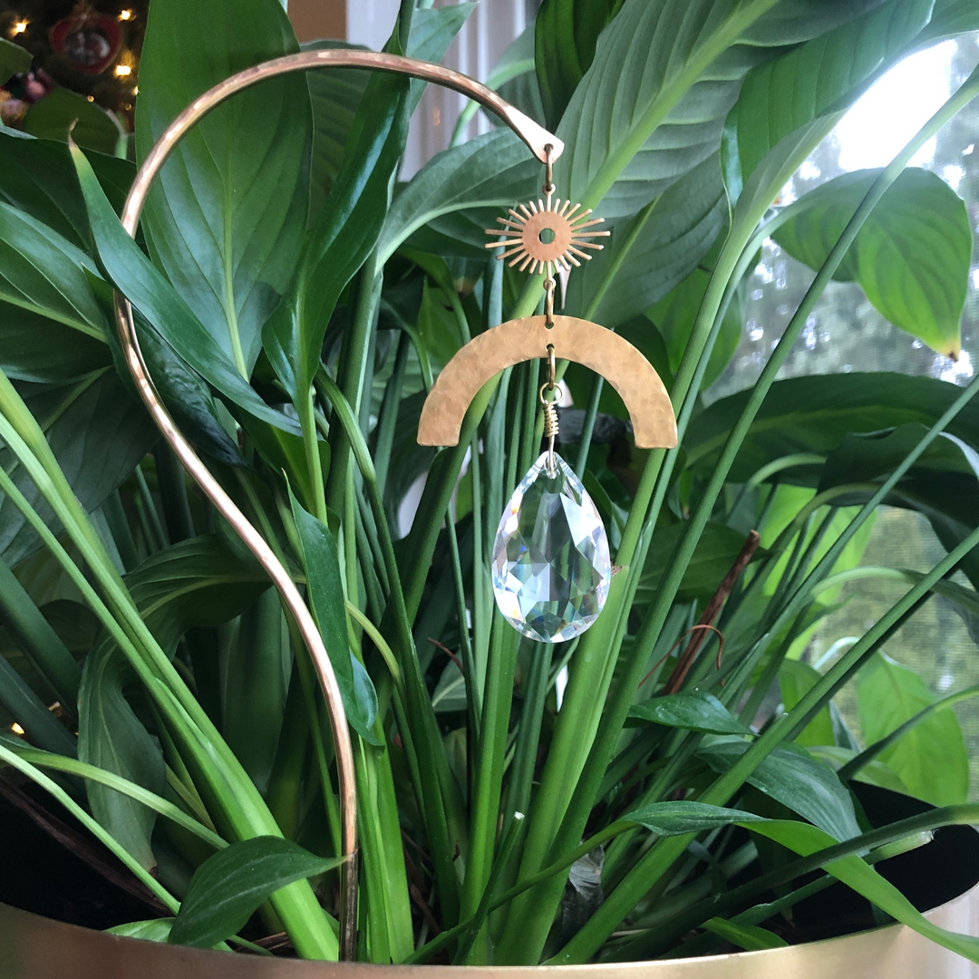 Garden suncatcher stick with curved metal ring and hanging faceted glass crystal