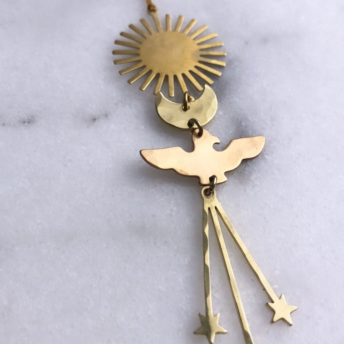 Gold angel ornament with halo sunburst and hanging star charms