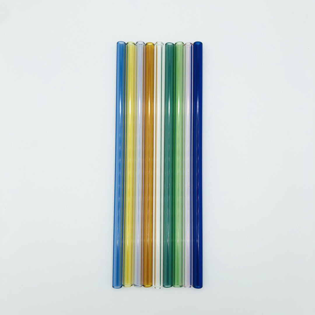 Assorted color reusable XL drinking straws in a plastic holder