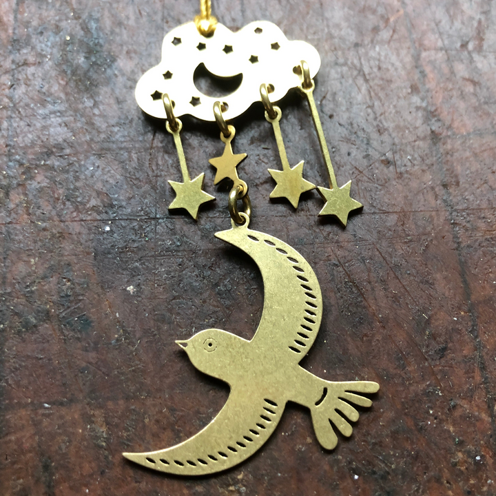 Moon ornament with gold crescent and bird, dangling stars and hanging loop