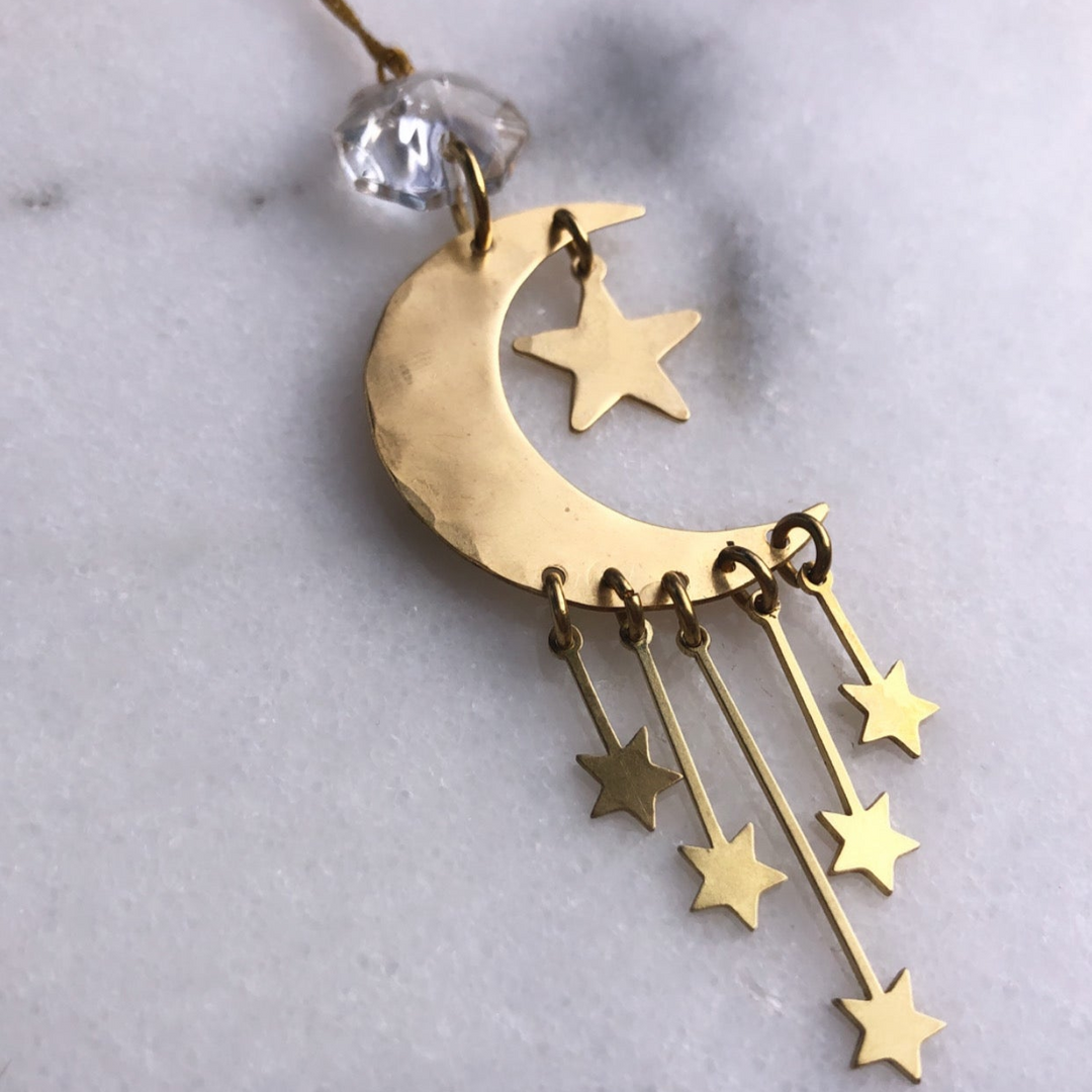Gold crescent moon ornament with star charms and clear vintage glass crystal topper