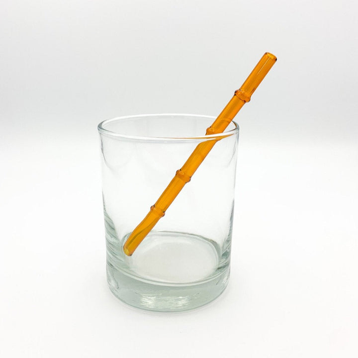 Bamboo-style drinking straw in amber orange, ribbed segmented look