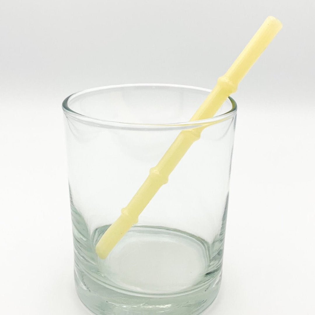 Bamboo-style drinking straw in pale yellow, ribbed segmented design