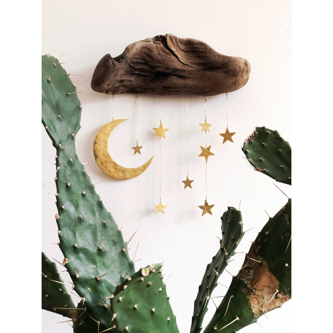 Natural wood moon and star wall sculpture with hanging gold star charms and cactus accents