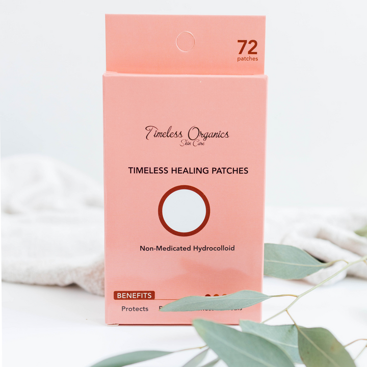 Peach-pink healing patch box with round hydrocolloid pads on a sheet.