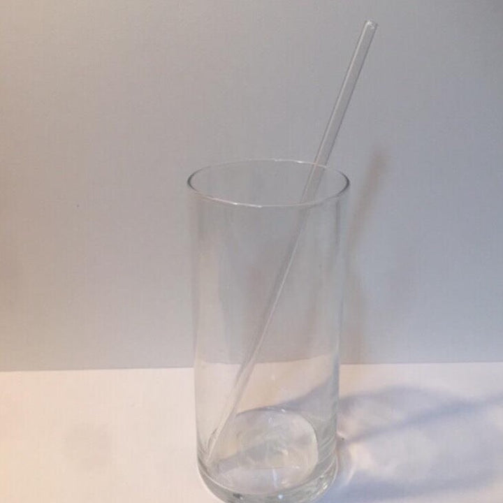 Smoke-grey reusable XL straight drinking straw in clear cup