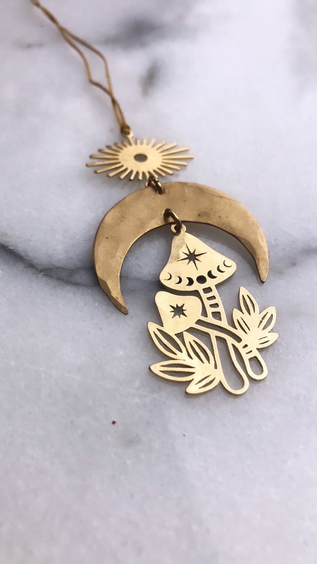 Gold mushroom ornament with crescent moon backing and hanging sun topper, loop