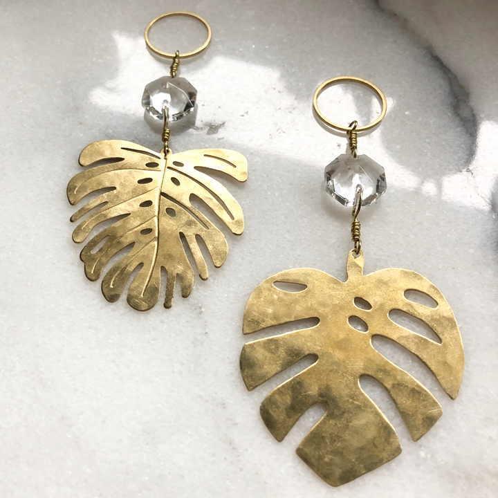 Gold monstera leaf suncatcher with clear faceted glass crystal and hanging loop