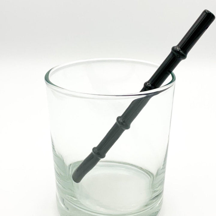 Bamboo-style drinking straw in dark charcoal, ribbed design