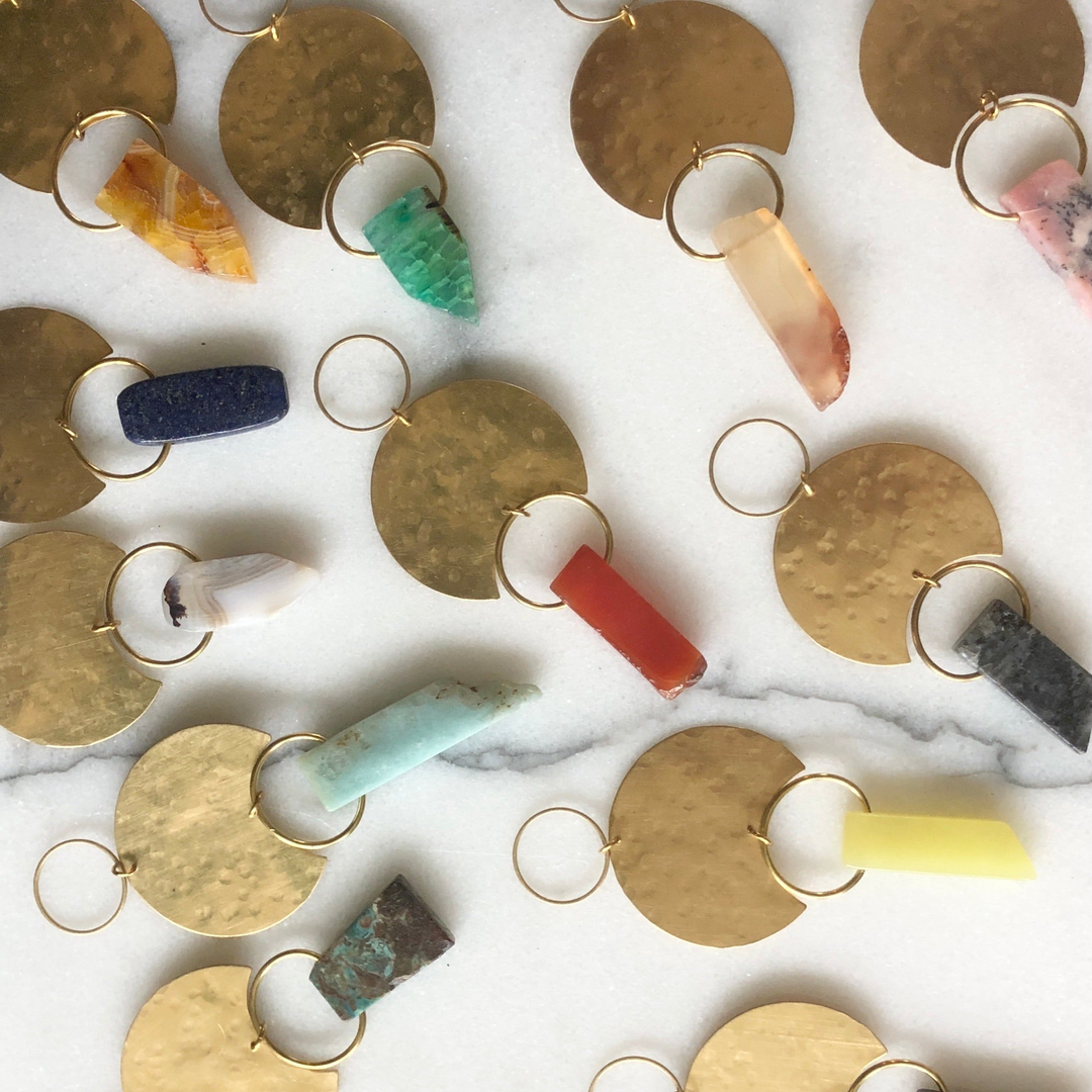 Assorted gemstone moon drop ornaments with gold-toned crescent moons and colored stone drops