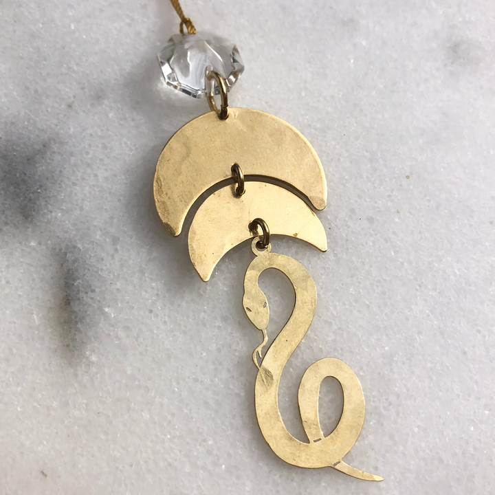 Gold serpentine ornament with clear vintage glass crystal charm and hanging loop