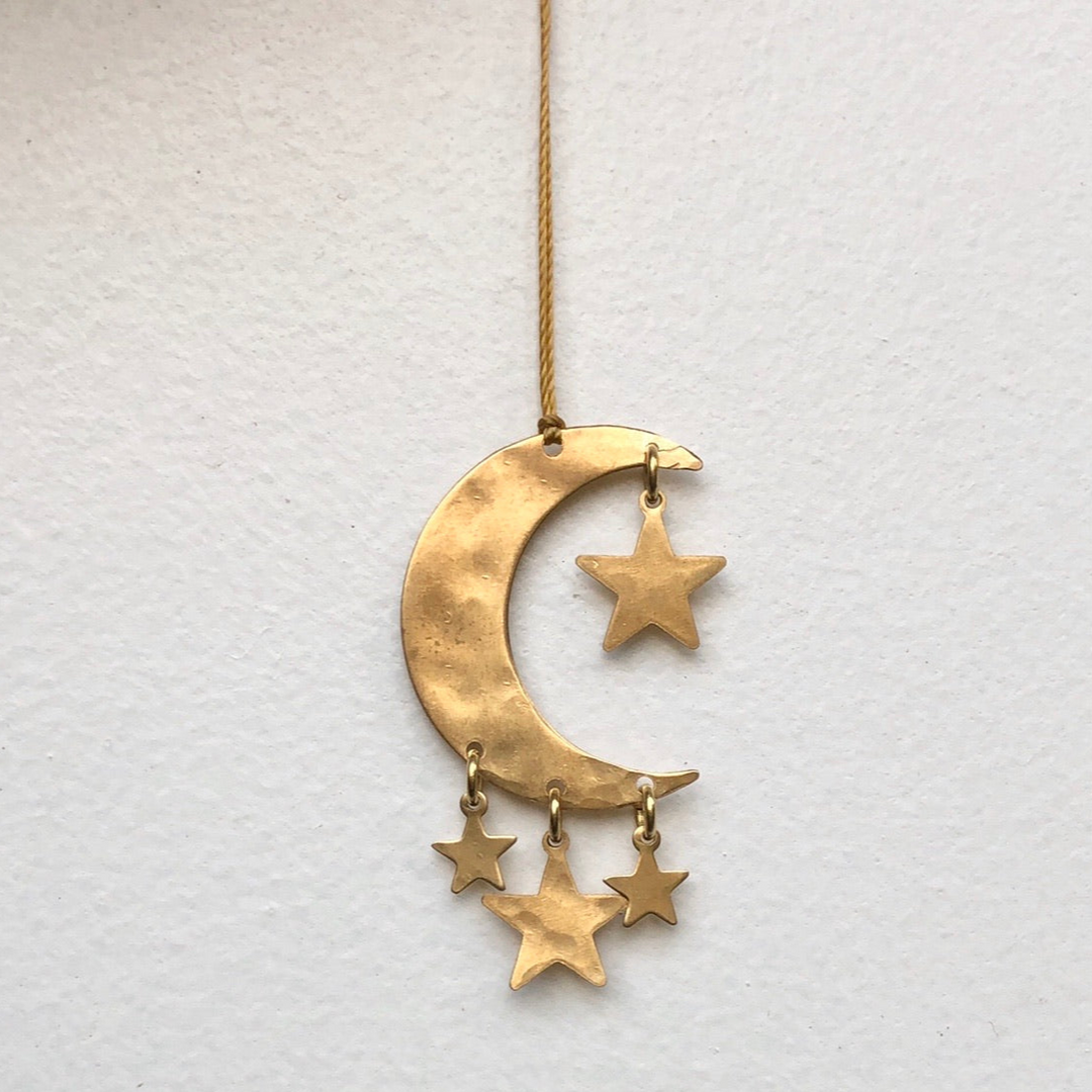 Gold crescent-moon ornament with hanging star charms and small moon detail