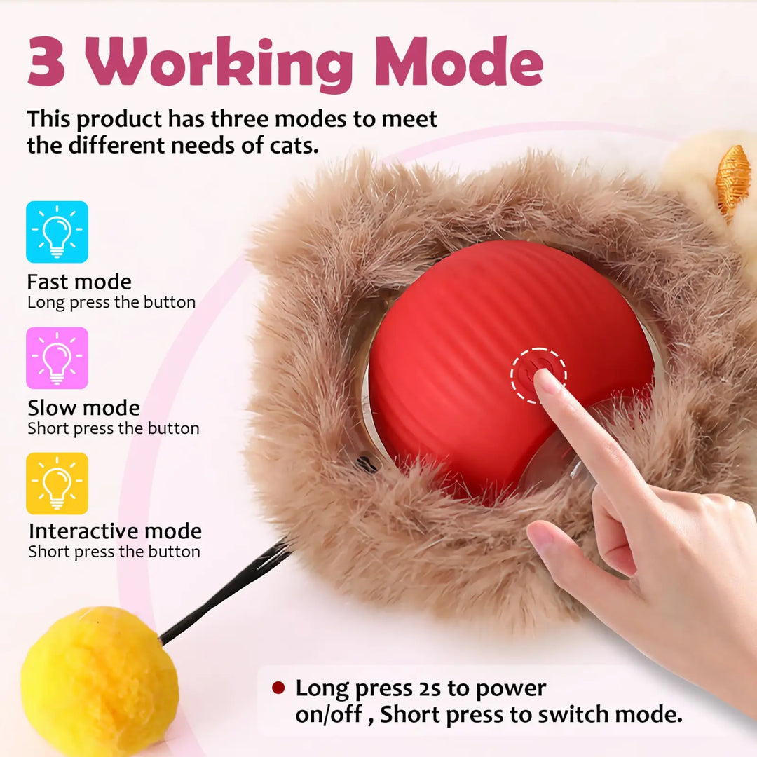 Fuzzy cat ball toy with red LED core and a finger pressing the mode button.