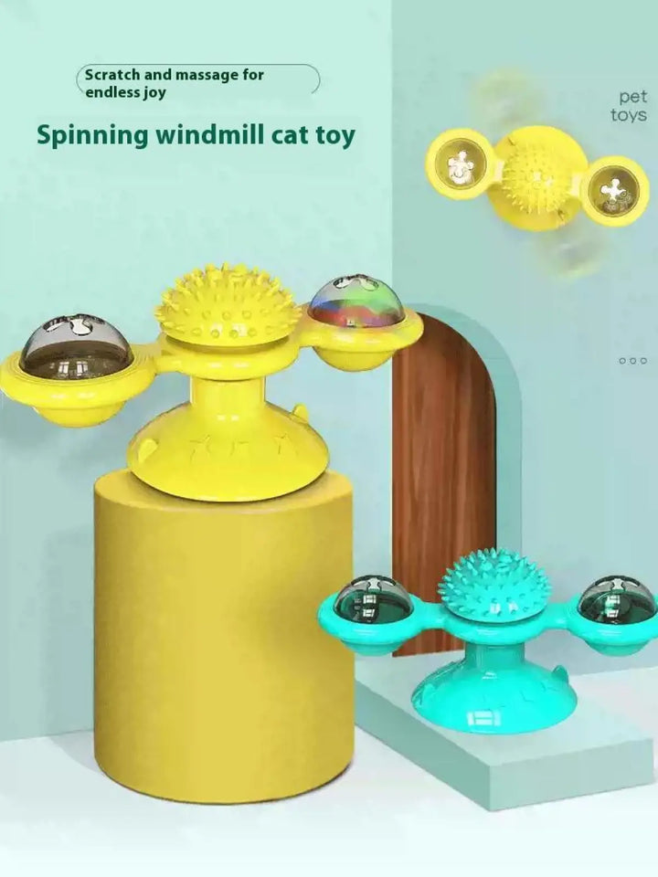 Yellow and teal spinning windmill cat toys with LED domes and spiked massage tops