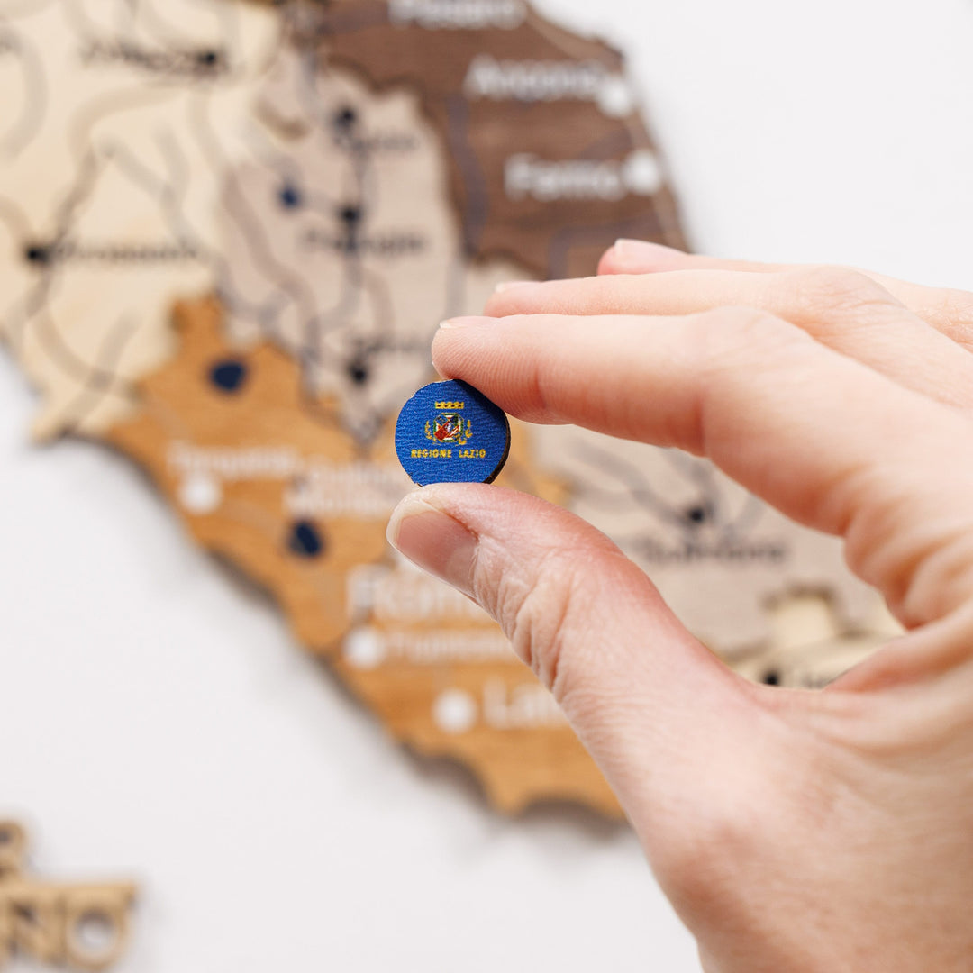 Round blue enamel Italy region pin with small white emblem