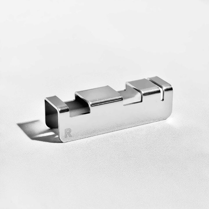 Polished stainless steel flatware rest clip with fork-slot opening