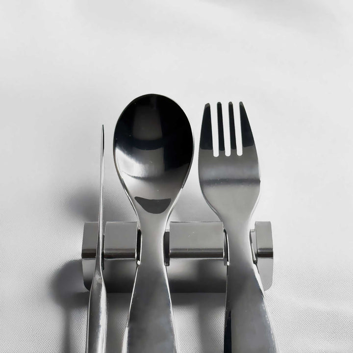 Polished stainless steel spoon-and-fork flatware rest with bowl and prong supports
