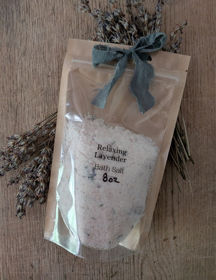 Relaxing Lavender bath salt pouch with gray ribbon bow and dried lavender sprigs
