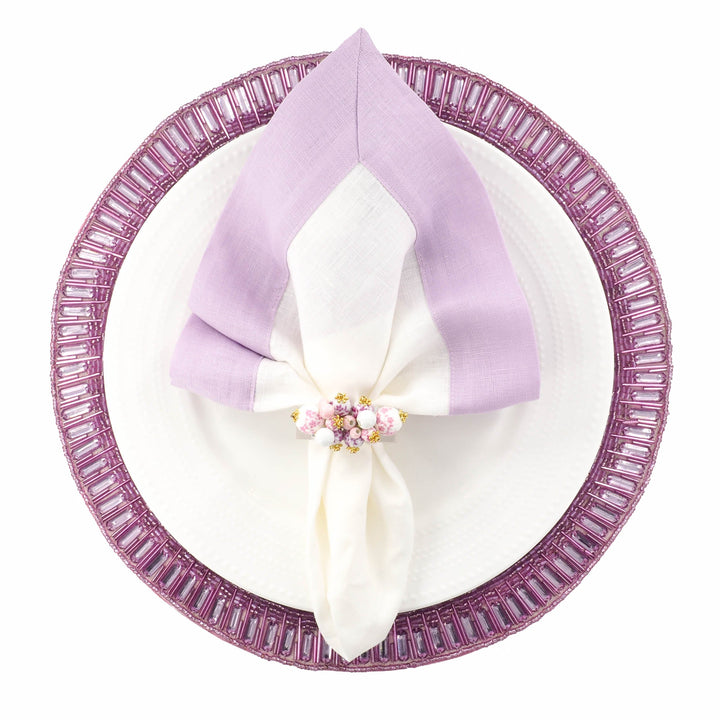 Lilac linen napkins with double-sided border, folded over center and layered