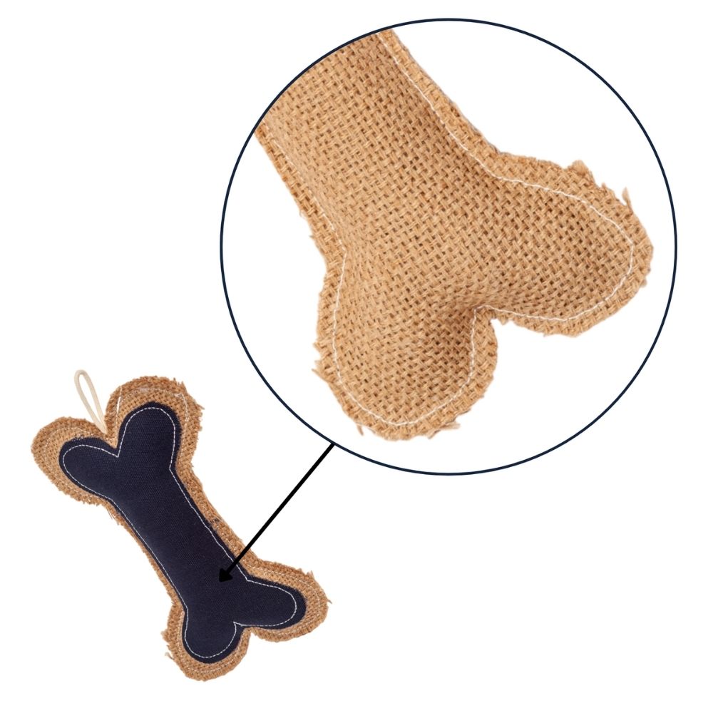 Close-up of bone-shaped dog chew toy showing tan jute texture and dark navy insert