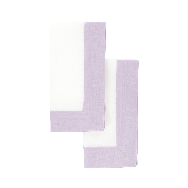 Lilac linen napkin with double-sided border, side view of folded corner
