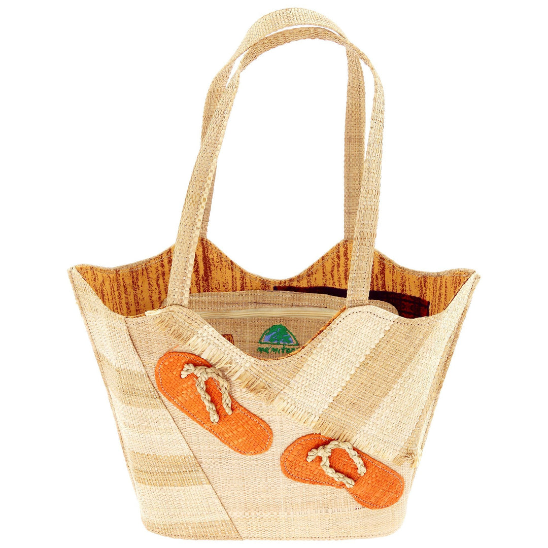 Raffia tote bag with orange strap accents and woven top handles