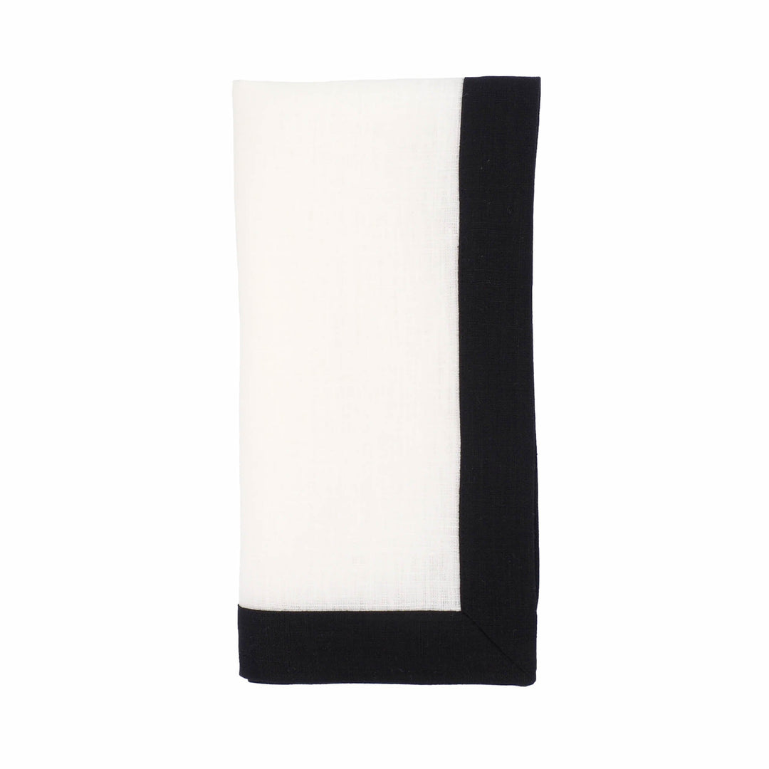 Single folded linen napkin with white center and vertical black side border.